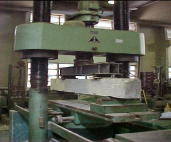 Press used for beam bending tests